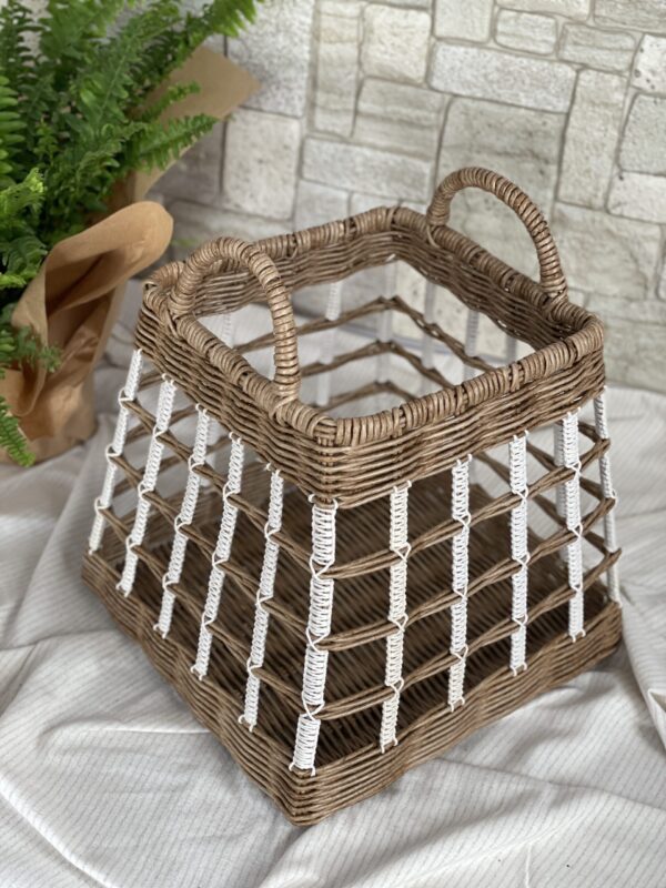 Basket with macrame elements in boho style